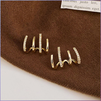 Daliva Korean Golden Cubic Zirconia 4 Earring Effect Claw Earring For Women/Girls Cubic Zirconia Alloy Stud Earring