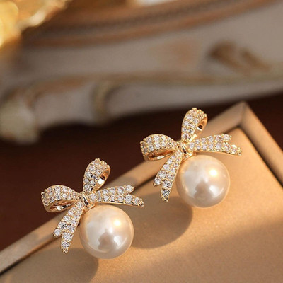 eloria gold plated bowknot stone stud trending korean pearl earring for woman and girls Pearl Alloy Stud Earring