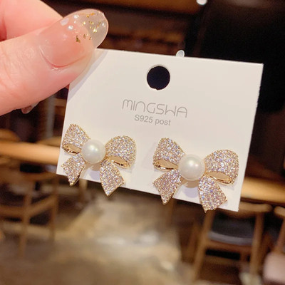 Celestria Bow Shaped Pearl Zircon Stud Earrings for women Pearl Alloy Stud Earring