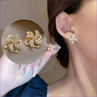 Daliva Korean Studded Windmill Rotating Gold-Plated Stud Earrings For Women Pearl Alloy Stud Earring