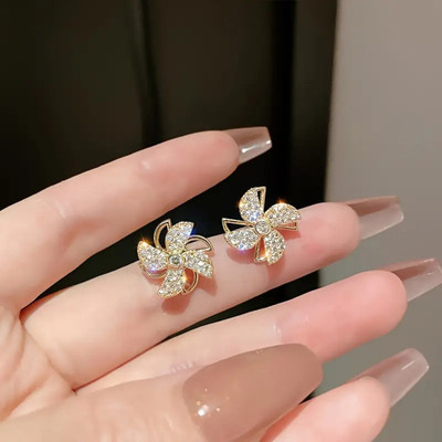 Vembley Korean Studded Windmill Rotating Gold-Plated Stud Earrings For Women Cubic Zirconia Alloy Stud Earring