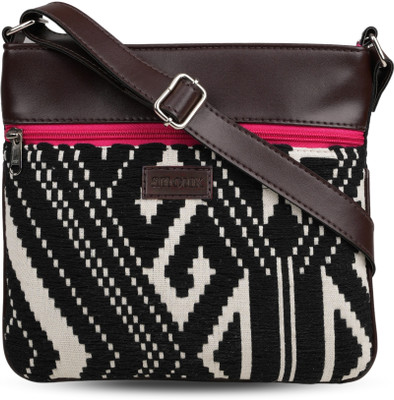 ANOUK Black Sling Bag A stylish textured sling bag with an adjustable strap