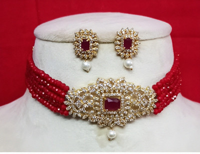 UNNATI JEWEL Brass Gold-plated Red Jewellery Set(Pack of 1)