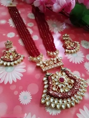 UNNATI JEWEL Brass Gold-plated Maroon Jewellery Set(Pack of 2)