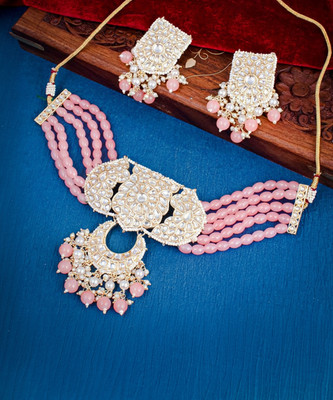 Sukkhi Brass Gold-plated Pink Jewellery Set(Pack of 1)