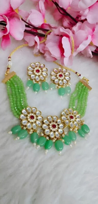 ARADHEMA Alloy Gold-plated Beige Jewellery Set(Pack of 1)