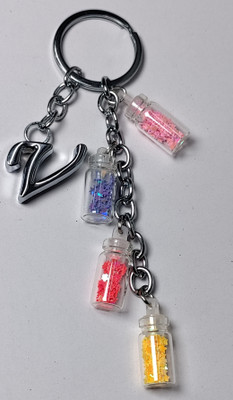 MOREL V ALPHABET METAL KEYCHAIN WITH COLORIZED SHINING STAR DRIFTING GLASS 4 BOTTLE Key Chain