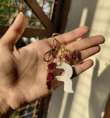 SnipNclip Crafts Rose preserved in R letter resin keychain with butterfly hu and a hook Key Chain