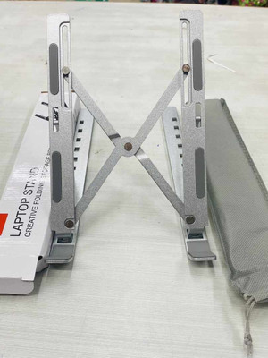 JMDOM Adjustable Foldable Compatible All Other Notebook Laptop Stand Aluminium Desk Stand Rotatable Laptop Stand with Adjustable Height Compatible with 26 - 35 cm Laptops(Silver)