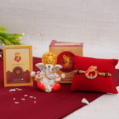 TIED RIBBONS Religious TR-RB21-Mini GaneshaCradRakhi-NK001 Assorted Rakhi, Showpiece, Greeting Card, Chawal Roli Pack Set(Rakhi Gift for Brother with Idol - 1 Ganesha Rakhi with 1 Mini Ganesha Idol , 1 Rakhi Special Card with Roli Chawal Combo Pack) TIED RIBBONS Religious TR-RB21-Mini GaneshaCradRakhi-NK001 Assorted Rakhi, Showpiece, Greeting Card, Chawal Roli Pack Set(Rakhi Gift for Brother with Idol - 1 Ganesha Rakhi with 1 Mini Ganesha Idol , 1 Rakhi Special Card with Roli Chawal Combo Pack)