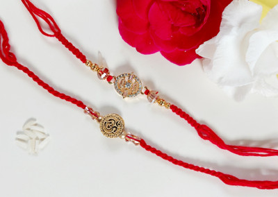BMG Designer Rakhi Set of 2 | Om Dial with Crystal Beads & AD Diamond Designer Rakhi Pearl Rakhi  Set(Roli Chokha)