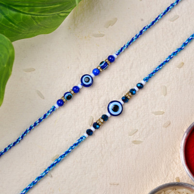 The Stone Aisle Designer 2 Evil Eye Rakhi Assorted Rakhi  Set(2 Rakhis, 1 roli, 1 Chawal)