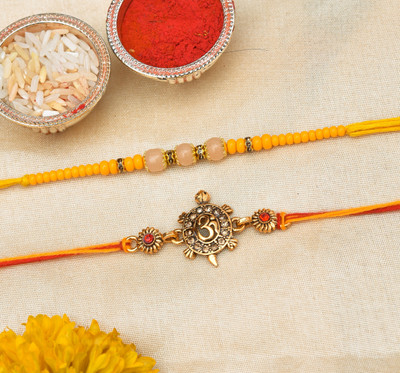 THE INDIA STYLE Designer Antic Matel Brass Kachua om and yellow Glass Moti Dori Rakhi set of 2 Mauli Thread, Assorted Rakhi, Chawal Roli Pack Set(Brass Kachua om and yellow Glass Moti Dori Rakhi Combo of 2, 1 Packet Roli Chawal) THE INDIA STYLE Designer Antic Matel Brass Kachua om and yellow Glass Moti Dori Rakhi set of 2 Mauli Thread, Assorted Rakhi, Chawal Roli Pack Set(Brass Kachua om and yellow Glass Moti Dori Rakhi Combo of 2, 1 Packet Roli Chawal)
