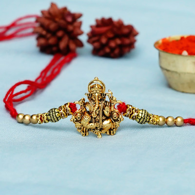 Religious Rakhi Assorted Rakhi, Chawal Roli Pack Set by Flipkart SmartBuy(1 Designer Ganesha Rakhi, 1 Roli Chawal Pack)