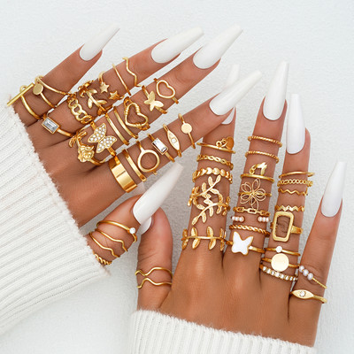 Shining Diva Set of 48 Latest Stylish Gold Plated Rings for Women and Girls (16379r) Metal Pearl Gold Plated Ring Set