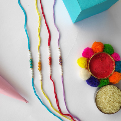 PDR Poonam Designer PD-4PC-R.DORI Mauli Thread Rakhi  Set(4 Rakhi, 1 Roli Chawal)