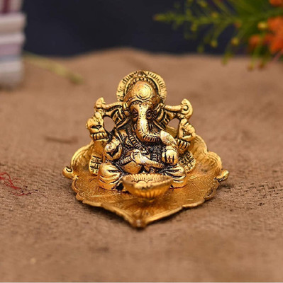 anil job works Metal Lord Ganesh Idol on Leaf with Diya for Home Decor and Gifts Decorative Showpiece  -  7.62 cm(Aluminium, Gold)