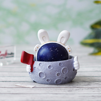 eCraftIndia rabbit astronaut Miniature statue on Moon shaking head with Red Flag Showpiece Decorative Showpiece  -  8 cm(Polyresin, Multicolor)