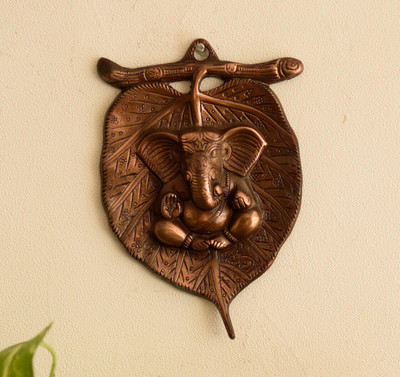 eCraftIndia Brown Metal Lord Ganesha On Leaf Wall Hanging Decorative Showpiece  -  21.59 cm(Aluminium, Brown)