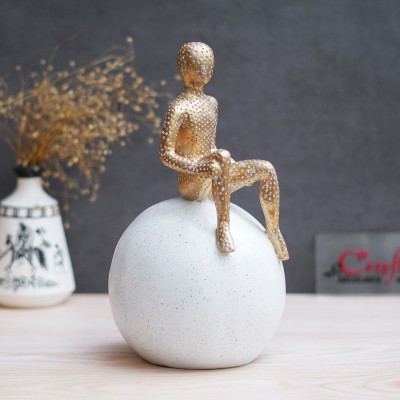 eCraftIndia Golden Boy Statue Sitting on White Ball Human Figurine Showpiece Decorative Showpiece  -  28 cm(Polyresin, Gold)