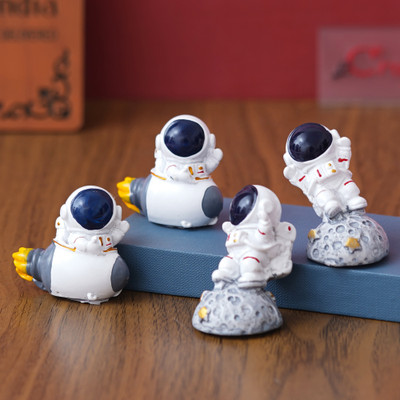 eCraftIndia Set of 4 Astronaut Statues Spaceman Figurines Decorative Showpieces Decorative Showpiece  -  5.5 cm(Polyresin, Multicolor)