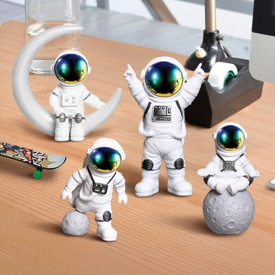 Ekhasa Nostrae Astronauts Miniature Toys & Cute Miniatures Decor Showpieces - Set of 4 Decorative Showpiece  -  7.8 cm(Resin, White, Black, Blue)