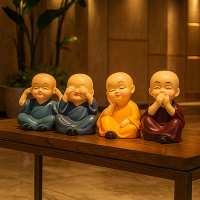 Lakriva Little Buddha Monk Decorative Figurines Pack of 4 Decorative Showpiece  -  7 cm(Polyresin, Multicolor)