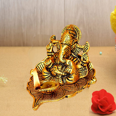 NOKTUS Ganesha on Leaf / Ganesh with Diya / Lord Ganesha Metal Hand Craved for Home Decorative Showpiece  -  8 cm(Metal, Gold)