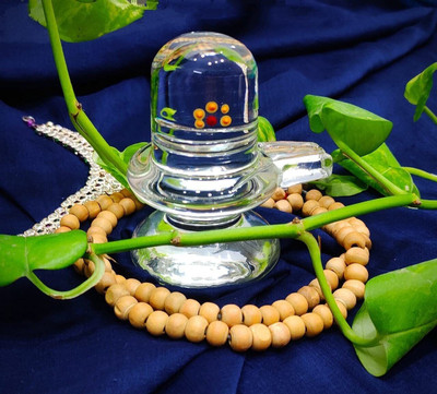 DARIDRA BHANJAN crystal shivling / glass shivling / sphatik shivling / pure sphatik shivling Decorative Showpiece  -  10 cm(Metal, Clear)
