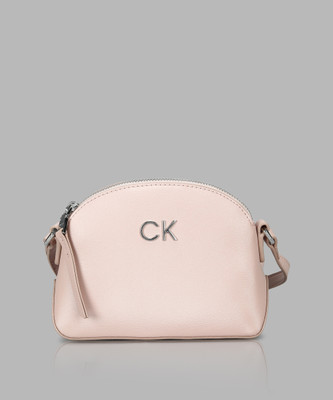Calvin Klein Grey Sling Bag CK DAILY SMALL DOME_PEARLIZED
