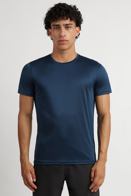 REEBOK Solid Men Round Neck Dark Blue T-Shirt