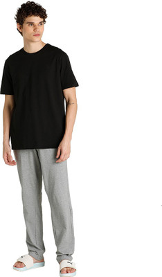 PUMA Solid Men Round Neck Grey T-Shirt