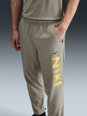 NIKE Solid Men Green Track Pants