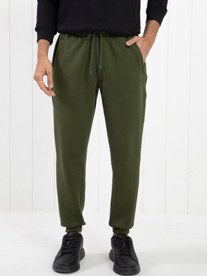 Rare Rabbit Solid Men Light Green Track Pants