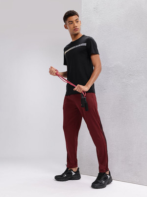 HRX by Hrithik Roshan Solid Men Maroon Track Pants