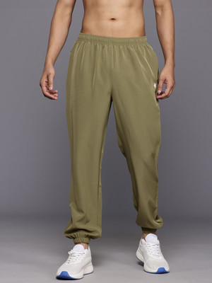 HRX by Hrithik Roshan Solid Men Orange Track Pants