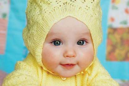 baby in yellow dress