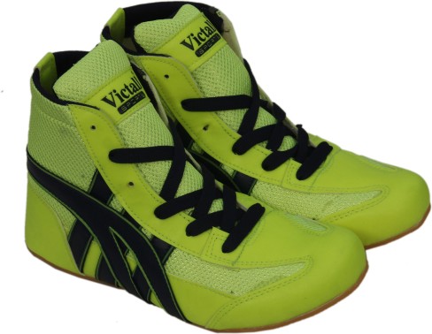 green and yellow wrestling shoes