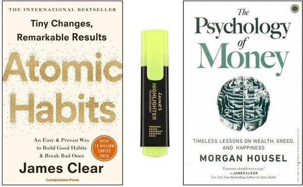 Atomic Habits & The Psychology Of Money With Yellow Pen Highlighter