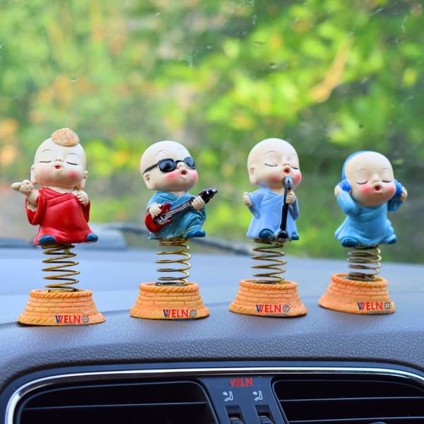 welno international Ceramic Singing Monk Buddha with Shaking Head Spring Showpiece for Car Dashboard Decorative Showpiece - 10 cm