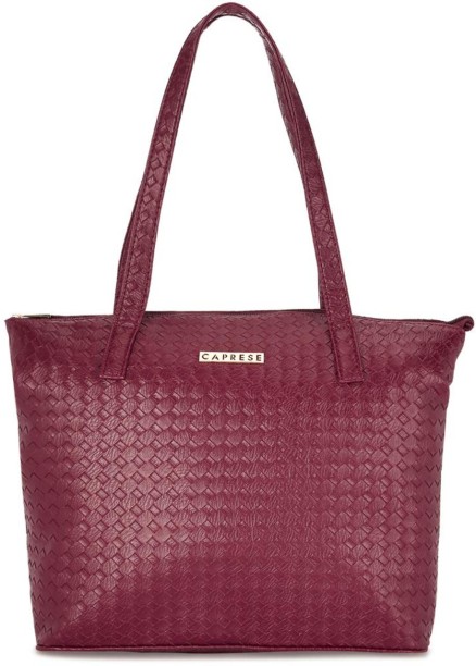 caprese maroon solid handheld bag