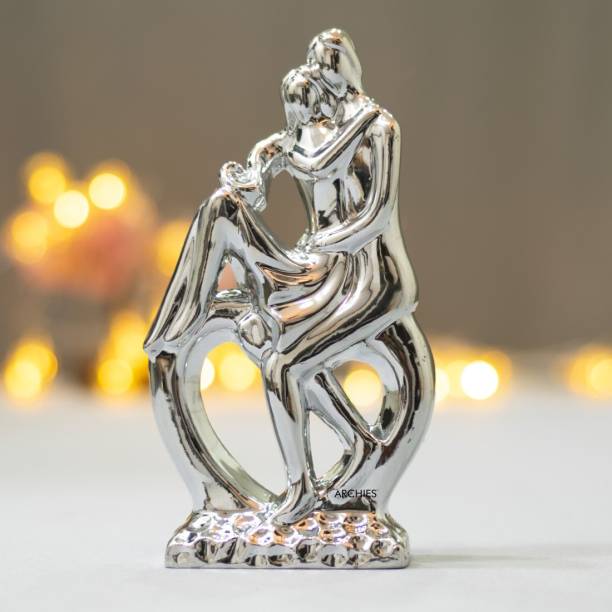 ARCHIES Premium Silver Couple Statue| Romantic Lovers Kiss| Romantic Couple Showpiece | Ceramic Polyresin Couple Figurine (Cm, Silver, Romantic Couple Kissing & Sitting Together) with a Romantic Gift Card for Girlfriend, Boyfriend, Husband, Wife, Anniversary, Home Decor, Gifting, Valentines Day Gifts, Teddy Day, Love, Happiness, Togetherness, Longevity, Positive Energy, Marital Bliss, Congratulations,Wedding, Engagement, Proposal, Special Occasion Decorative Showpiece  -  21 cm