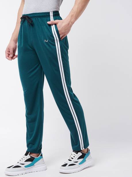 Green track pants with white outlet stripe