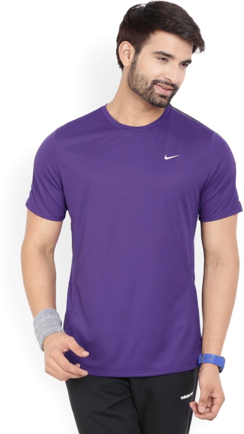purple black and white nike shirt