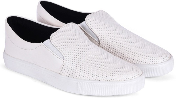 white faux leather slip on sneakers