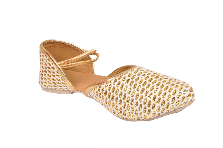 white and gold flats