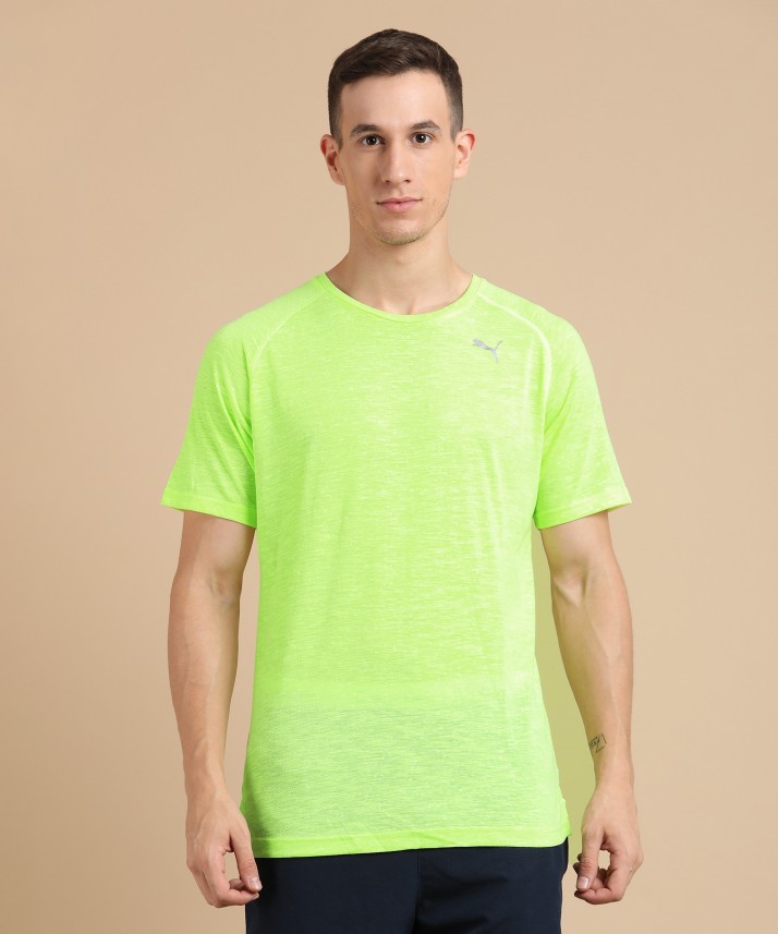 green and yellow puma shirt