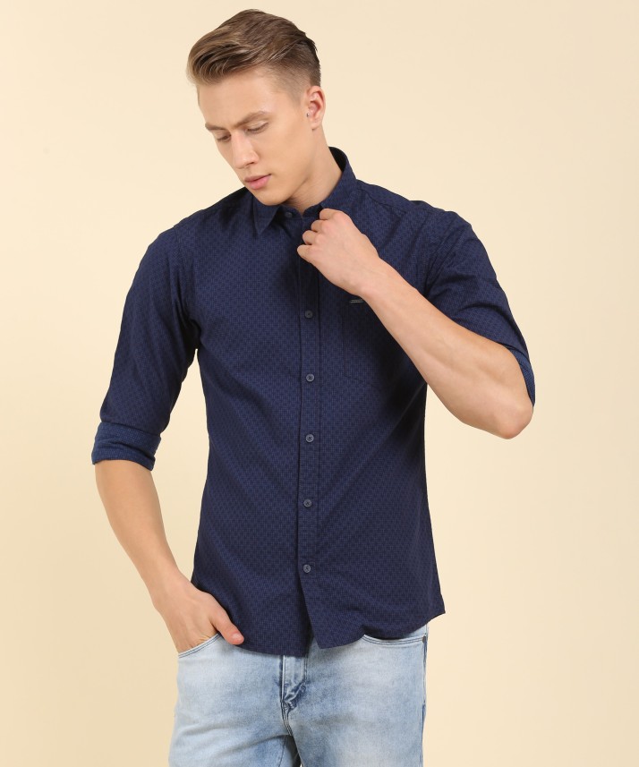 navy blue shirt with dark blue jeans