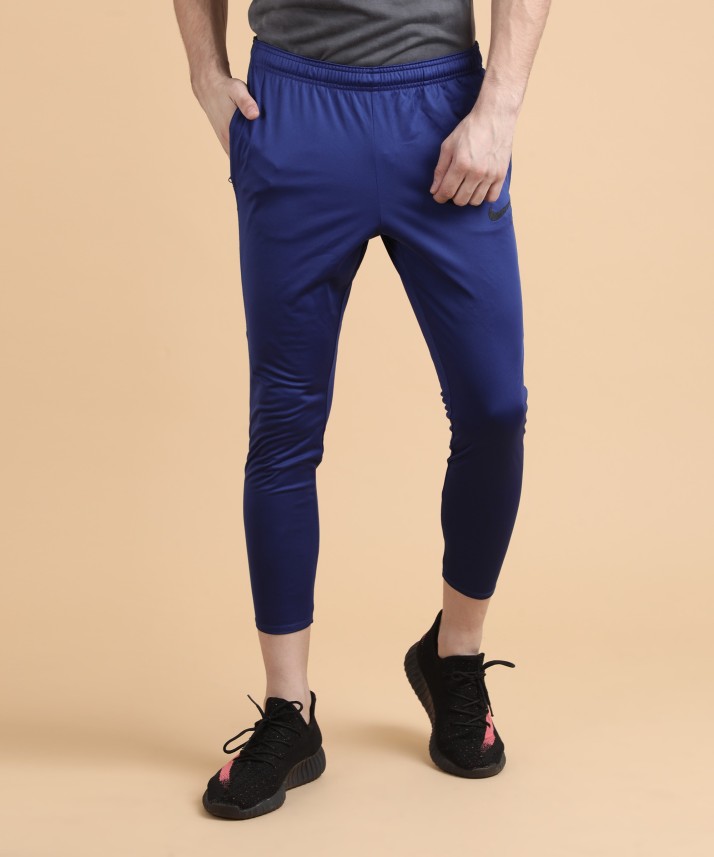 Nike Solid Men Blue Track Pants - Buy 