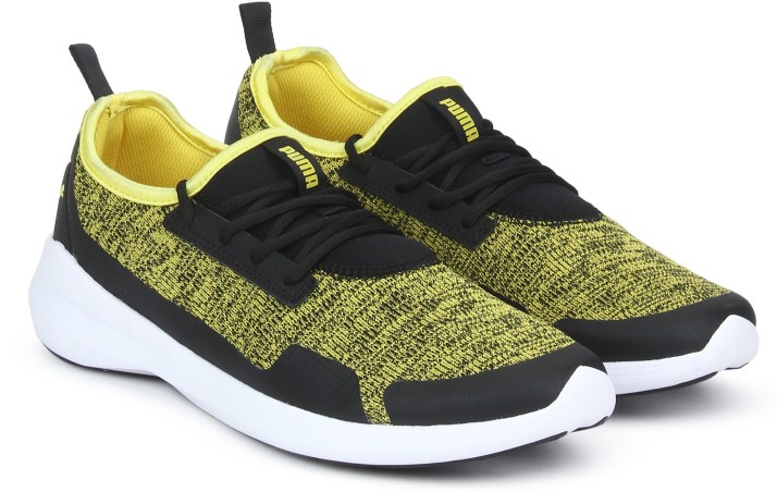 black and yellow puma sneakers